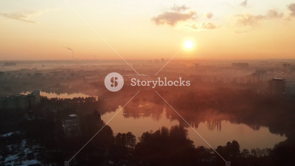 Cityscape of Bucharest from a drone, rows of residential buildings, thermal station with fog getting out and other the ground, ecology idea, Romania