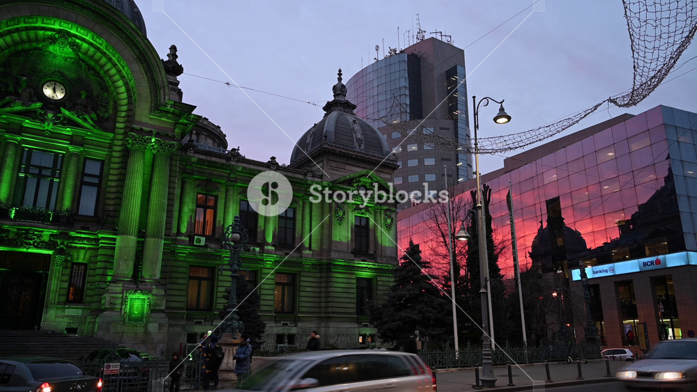 Bucharest, Romania - January 10, 2021: Street view of the illuminated Palace of the Deposits and Consignments in the evening