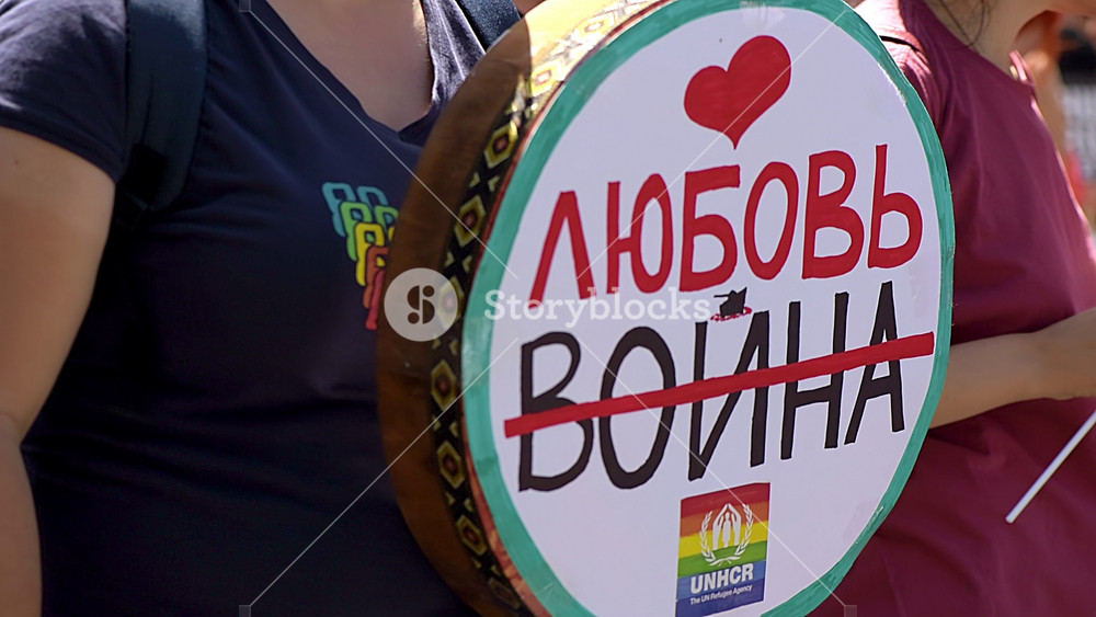 CHISINAU, MOLDOVA - JUNE, 2022: ''Say no to war, yes to love'' written on woman drum at the gay pride parade in the center of Chisinau, Moldova