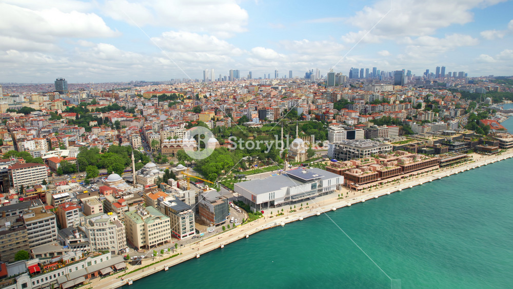 Aerial drone view of Istanbul, Turkey. Bosporus strait, Galata port, multiple residential and office buildings, mosques, greenery, skyscrapers on the background