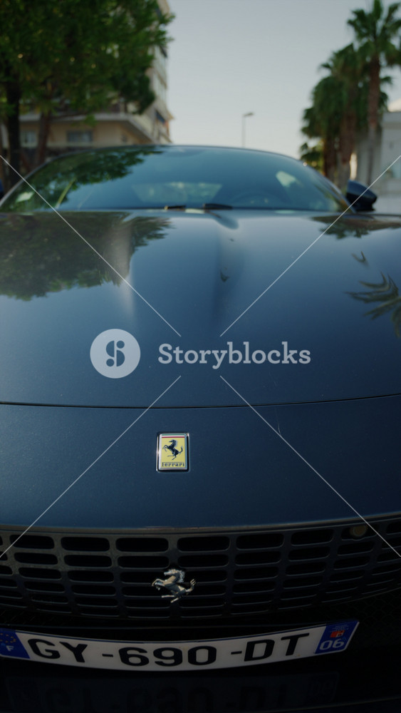 Gofe Juan Vallauris, France - May 24, 2026: Close up of Ferrari emblem on a dark luxury sports car exterior parked on the street