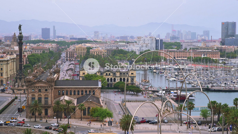 Aerial drone view of the Port Vell, the Columbus Monument and the Junta d'Obres del Port building in Barcelona, Spain