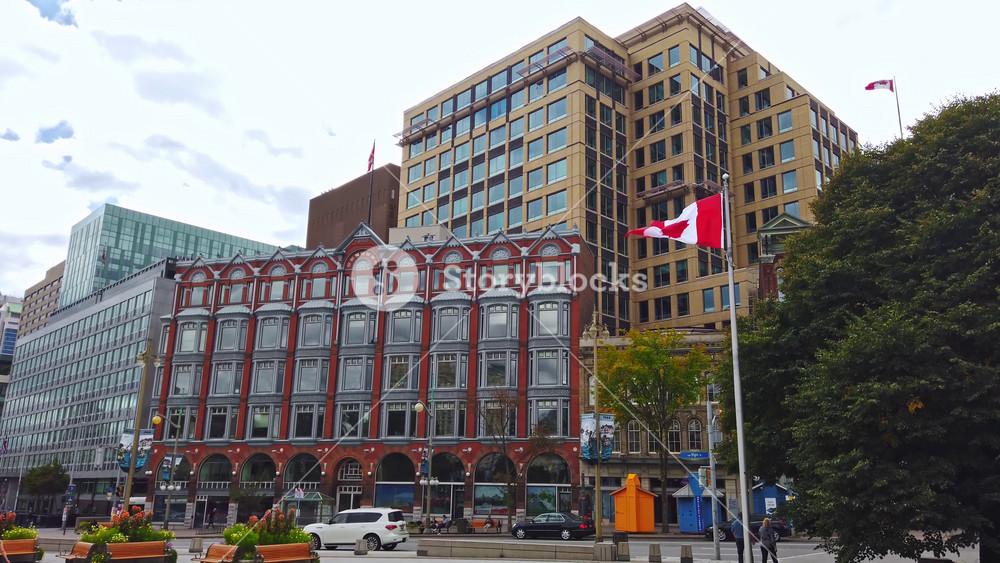 OTTAWA, CANADA - SEPTEMBER 21, 2019: People walking and cars driving near Central Chambers at the corner of Elgin Street and Queen Street. Bottom view