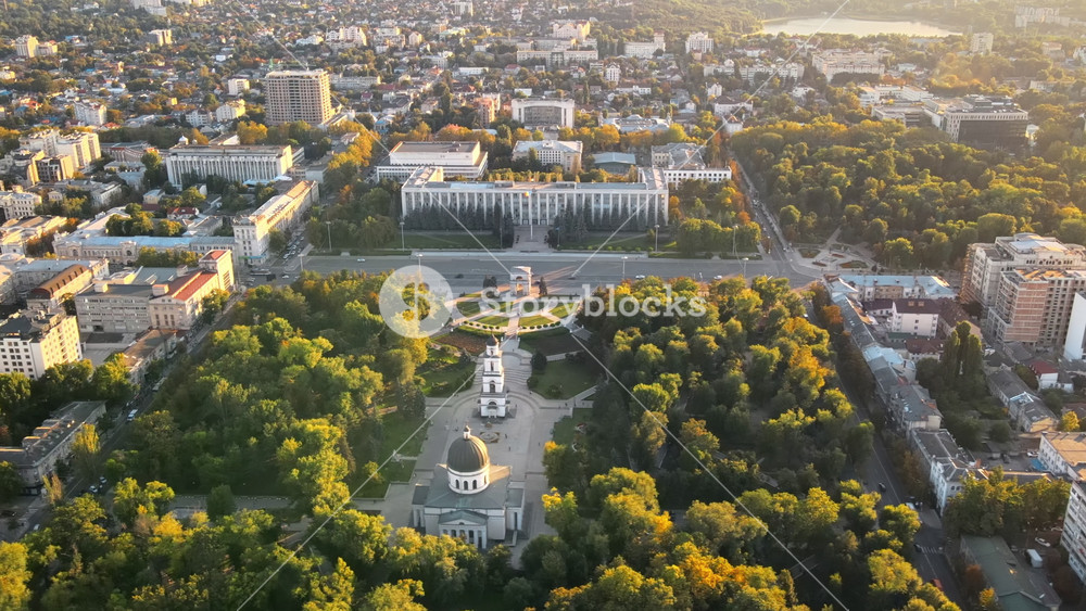 Aerial drone view of Chisinau downtown at sunset. Panorama view of Central Park, Cathedral, Goverment a lot of greenery, buildings. Moldova