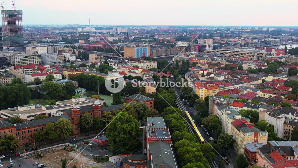 Aerial drone view of Kreuzberg, Berlin, Germany. Residential district with greenery, office and residential buildings, roads with moving cars