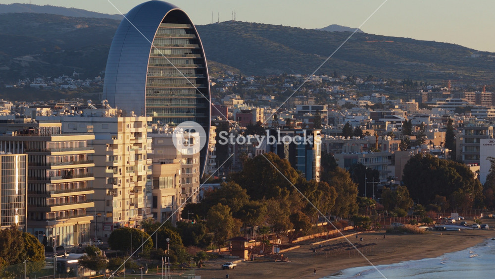Limassol , Cyprus - February 26, 2026: Aerial drone view of the Oval Building and surrounding coastline in Limassol, Cyprus