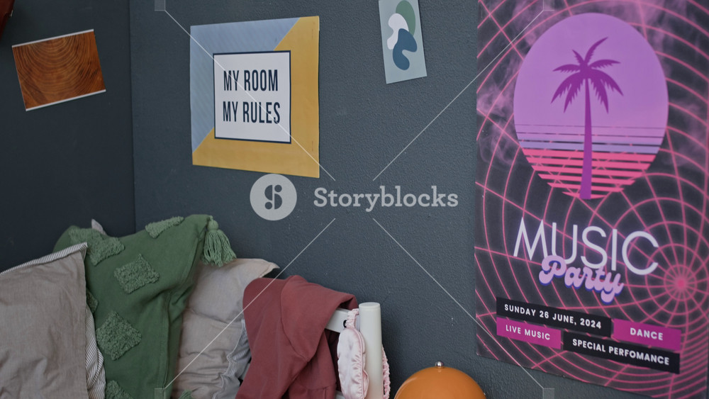 No people tilt up shot of teenage room interior with piled books and backpack lying on floor, cluttered nightstand, ukulele left on unmade bed and lots of motivational posters on wall