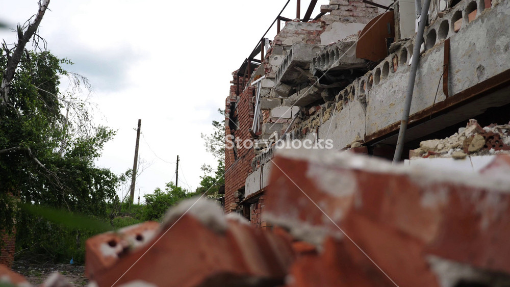 View to destroyed residential buildings at Kharkivska oblast. Ruined houses after bomb attacks on ukrainian territory from russia army. Consequences of russian invasion of Ukraine. Slow mo