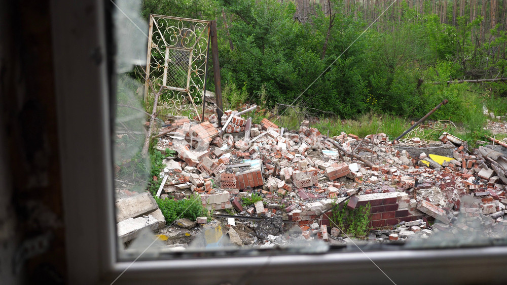 View to destroyed residential buildings at Kharkivska oblast. Ruined houses after bomb attacks on ukrainian territory from russia army. Consequences of russian invasion of Ukraine. Slow mo