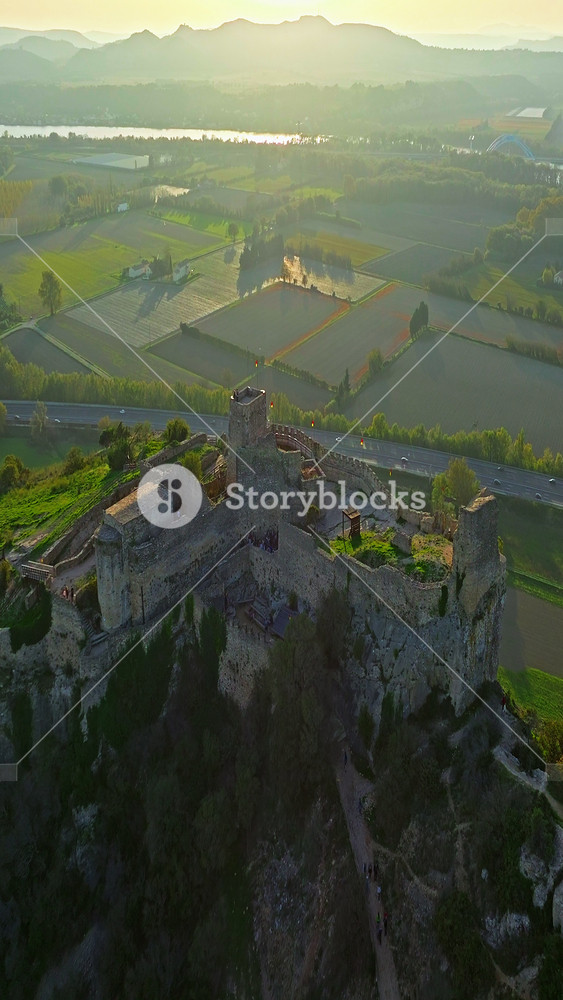Mornas Fortress stands majestically on top of a rocky cliff. The Fortress of Mornas is a medieval fortress above the village of the same