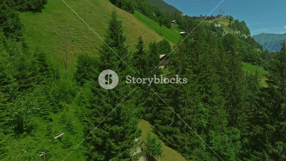 Incredible mountainous terrain of the Swiss Alps. Pristine stunning green Swiss nature in summer. Aerial view of the such an amazing view of Switzerland. Green alpine valley in Switzerland