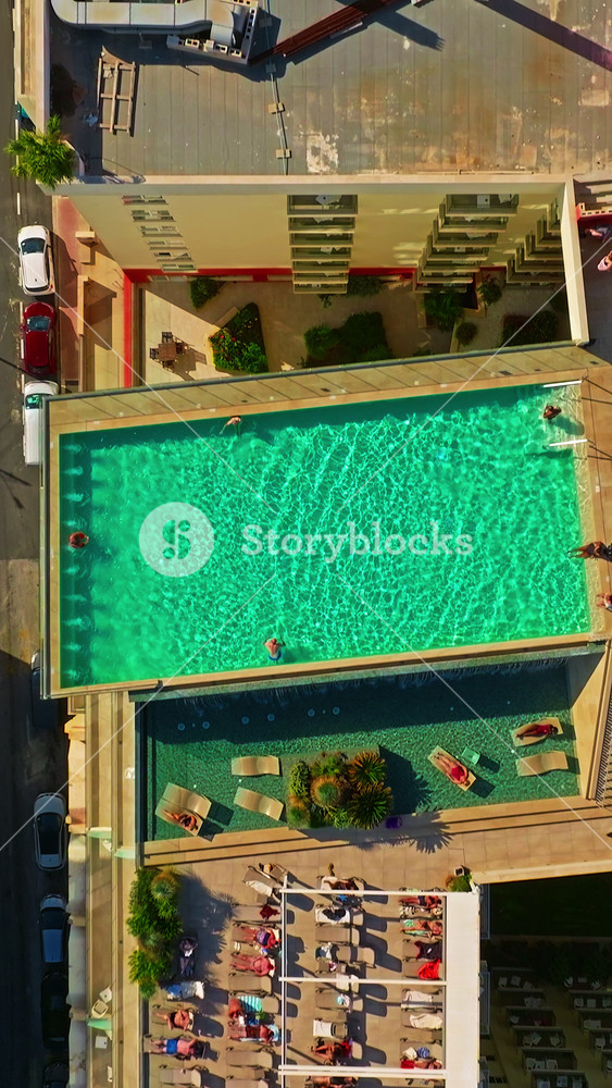 Aerial view of tourist apartments with a swimming pool on the island of Malta. The housing market and construction of tourist housing on the