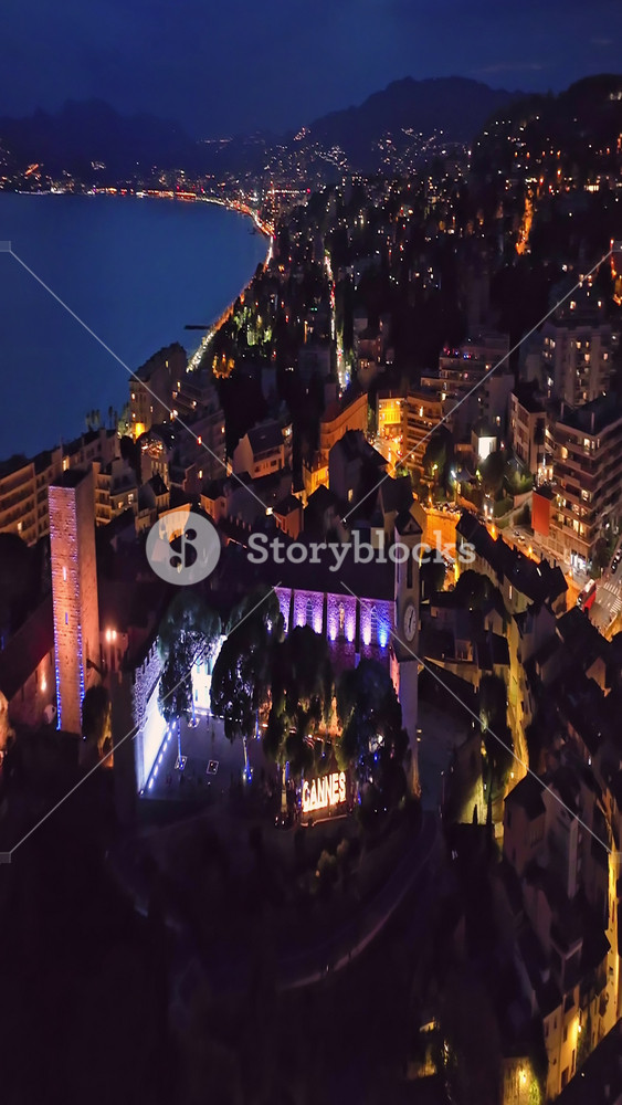 Aerial video in Cannes with a view of the beach and luxurious buildings at Night. Prestigious nightlife in Cannes. Cannes renowned for best