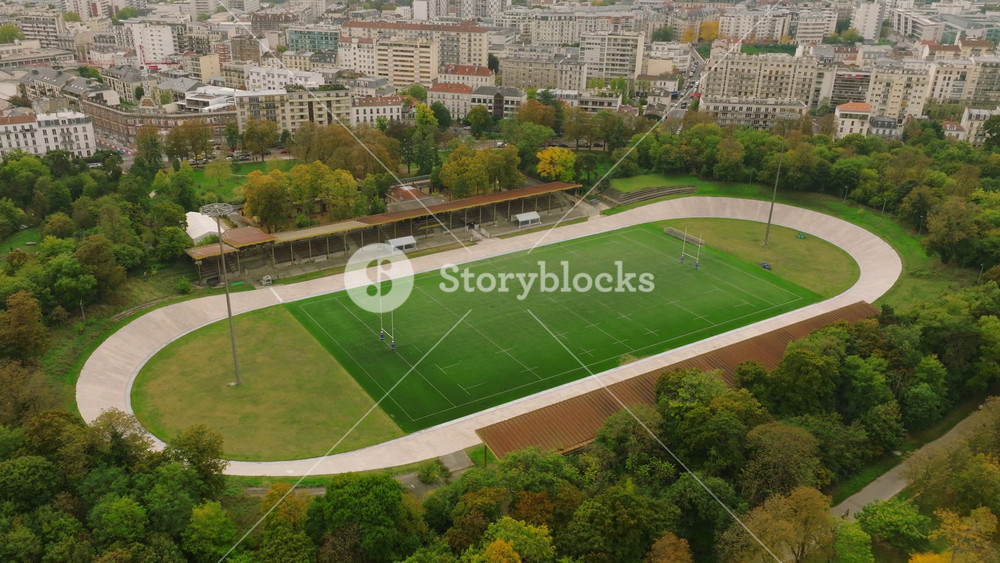 Aerial view American football stadium. American football stadium grass field with glowing spotlights on the top. Sport advertisement