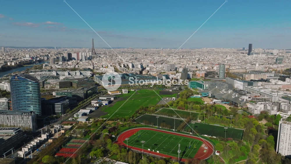 0 V1 0233 Paris aerial video with view of bridges, Seine river and Eiffel tower. Historic Parisian city center from above during warm summer. Famous holidays vacation destination