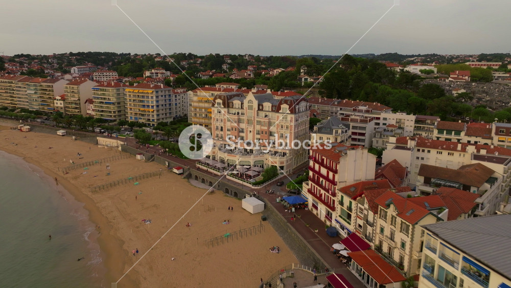Biarritz large aerial view of the main beach and Biarritz city sunny afternoon France. View of facade of Hotel Sofitel Biarritz Le Miramar Thalassa Sea and Spa on the Miramar beach
