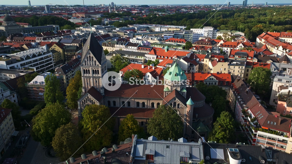 Aerial drone view of Kirche St. Anna (Pfarrkirche St. Anna), a historic Catholic church with Baroque architecture, located in the Lehel district of Munich, Germany . 30 September 2024.