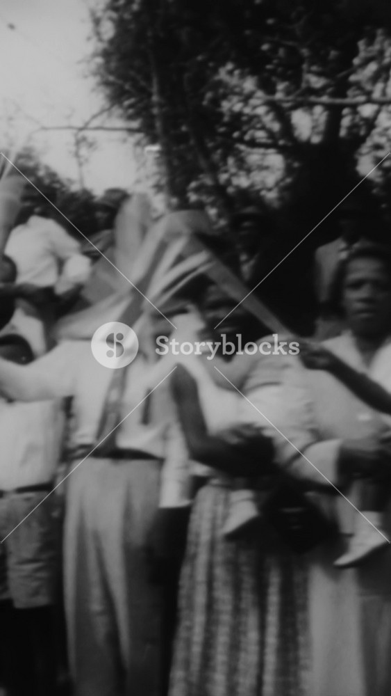 1953 - Bermuda's governor, Sir Alexander Hood, tours Queen Elizabeth II and Prince Philip around the island where they are cheered by flag-waving crowds.