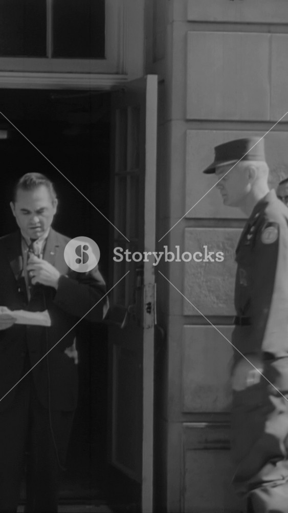 1963 - Governor George Wallace yields to federal authority when Brigadier General Graham comes to the University of Alabama on JFK's orders to integrate the school.