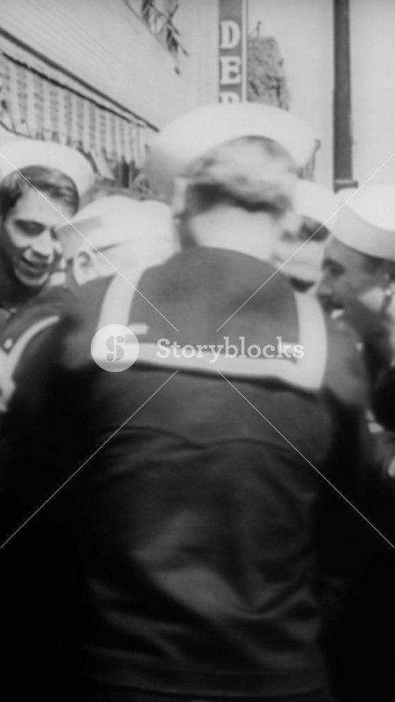 1942 - A US Navy sailor welcomes home his seven sons, all in the navy, for a furlough. Their youngest brother is sworn in to the service.