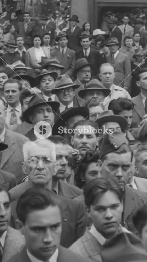 1944 - Servicemen and civilians of different races listen to Mayor La Guardia give a speech and unveil a billboard advocating for religious tolerance in the military in New York City.
