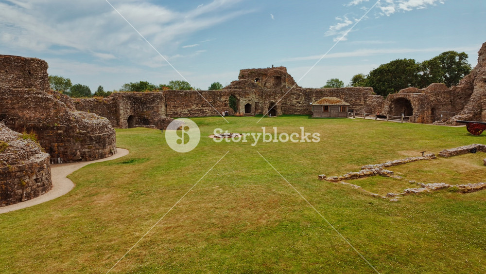 PEVENSEY, United Kingdom, 15 June 2025 - Medieval English Castle at Pevensey, East Sussex, England, UK, with ruined walls, towers and a broad marshland setting