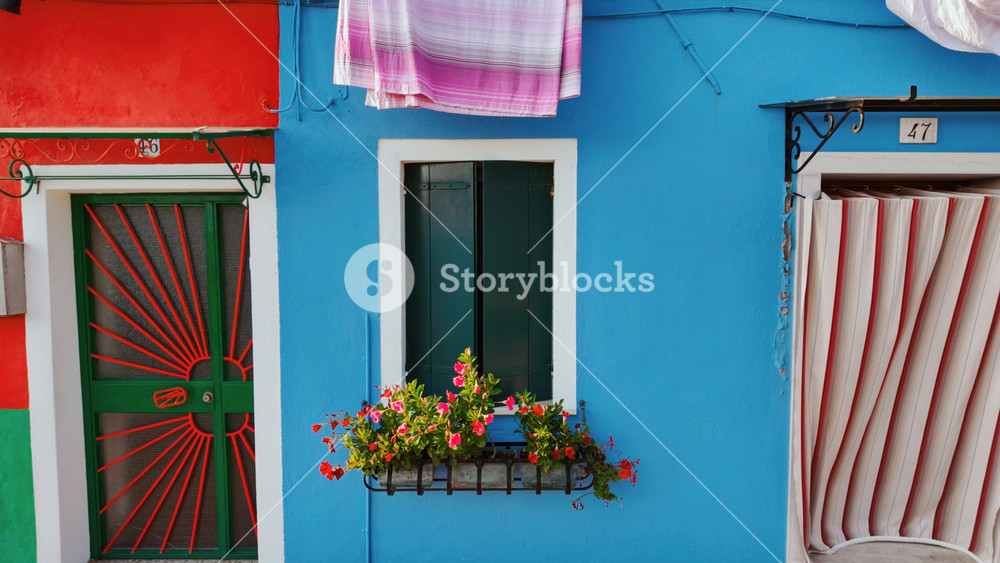 Revealing a group of colorful and traditional houses in the island of Burano, Venice, Italy. Venice is an archipelago of 126 islands linked by 472 bridges