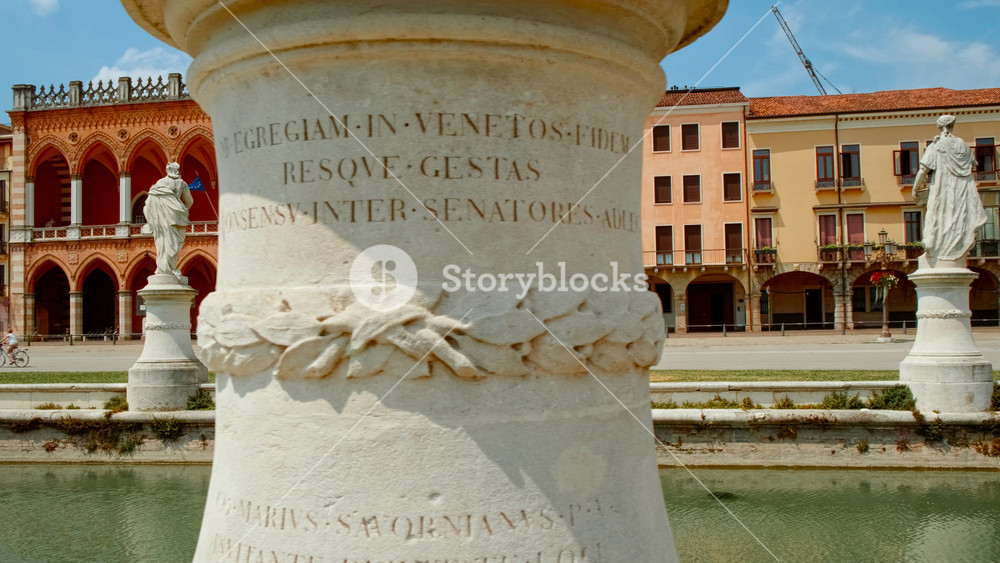 PADOVA, Italy, 15 JULY 2024 - An expansive green island ringed by reflective canals and historic sculptures in the heart of the plaza, Prato della Valle Square, Padova, Padua, Veneto, Italy