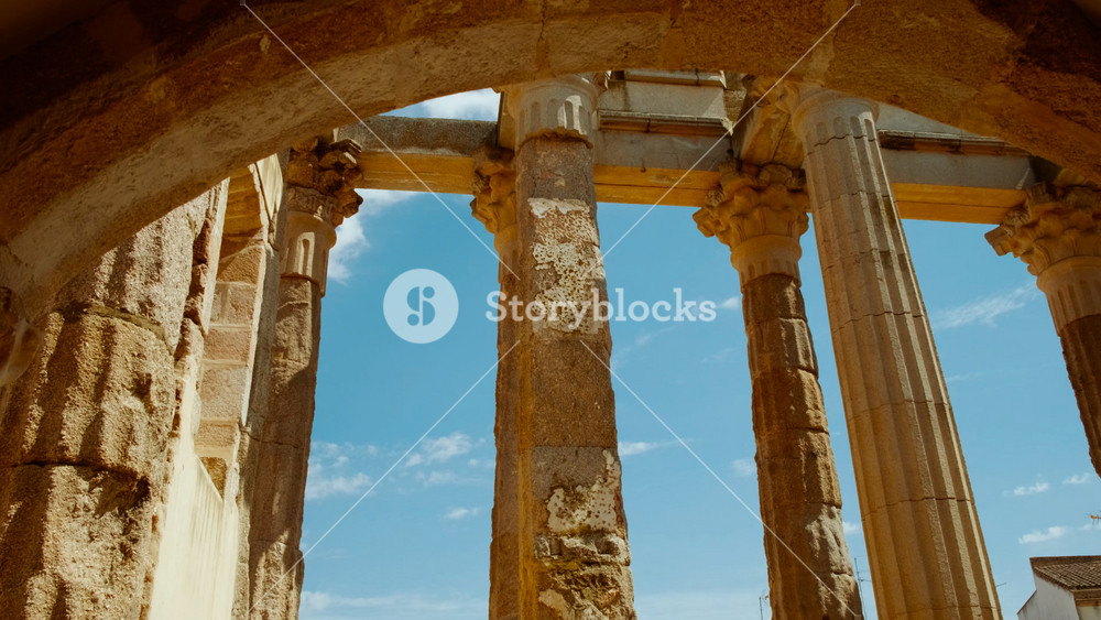 Temple of Diana, Merida, Extremadura, Spain, dating to 1 BC, majestic Roman relic standing tall, epitomizing historic grandeur amid modern urban life