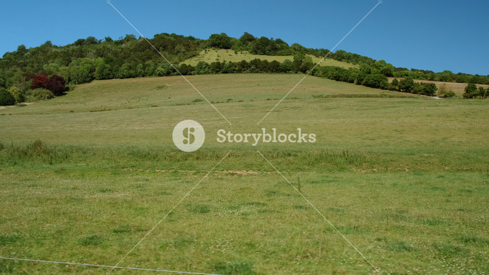 Tracking shot of the stunning fields of Surrey Hills, a 422 km2 Area of Outstanding Natural Beauty, in the county of Surrey, England