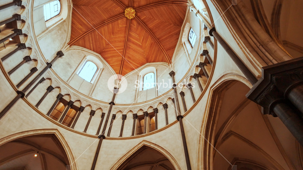 LONDON, United Kingdom, 15 October 2025 - The interior of Temple Church, London, England, UK, showing the round plan, patterned floor and simple benches in a calm setting