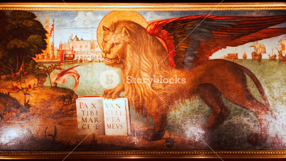 VENICE, Italy, 7 November 2024 - The Winged Lion of St Mark painting, Venice, Veneto, Italy, with gilded halo, bold brushwork and symbolic text on a rich background