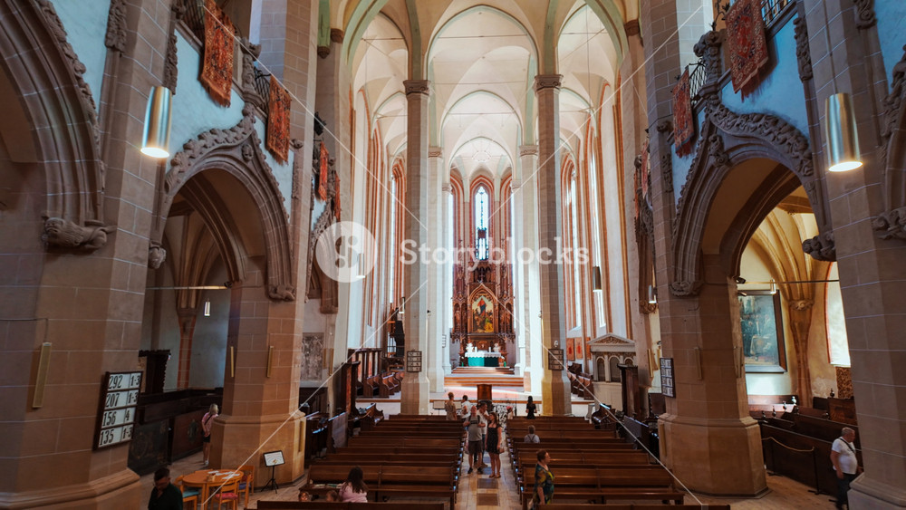 BRASOV, Romania, 7 September 2025 - The interior of the Black Church, Brasov, Transylvania, Romania, vaulted nave, stone pillars and soft light