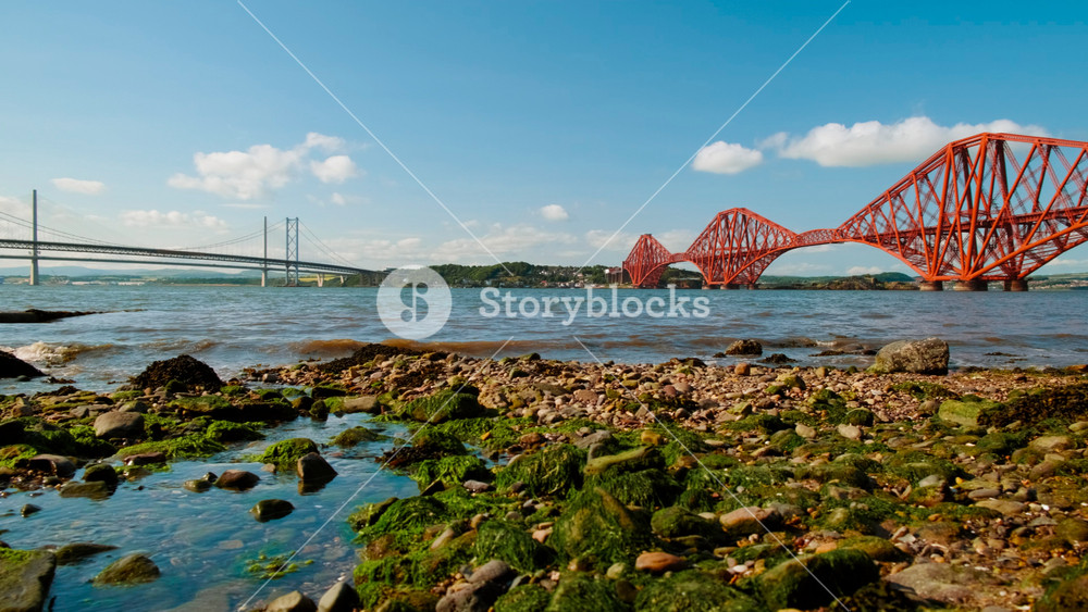 Stunning view of the Firth of Forth in Scotland, UK, featuring the Forth Railway Bridge, an amazing feat of Victorian engineering. The Forth Bridge was inscribed as a UNESCO World Heritage Site