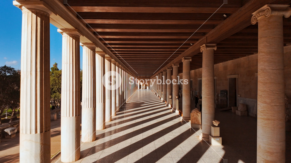 ATHENS, Greece, 14 January 2026 - Perspective view down the long colonnade of the Stoa of Attalos in the Ancient Agora, Athens, Greece with stunning contrast between light and shadows