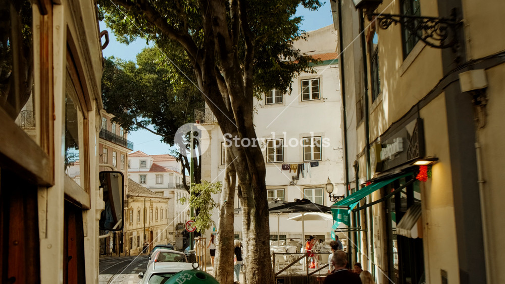 LISBON, Portugal, circa 2022 - Traveling in the iconic tram 28 along the picturesque streets of Alfama, the oldest and most famous district of Lisbon, Portugal