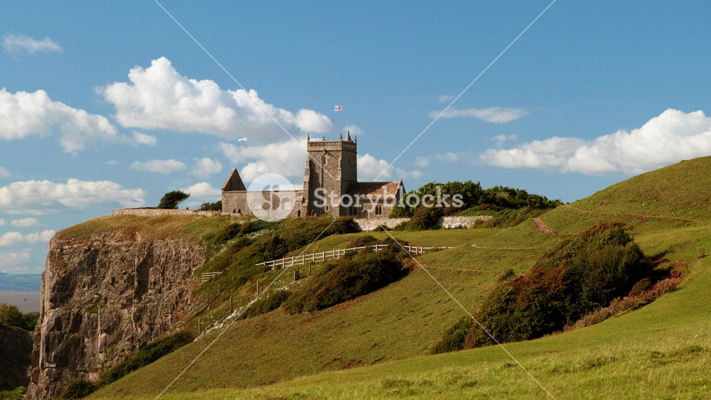 Slow motion POV walk towards the stunning Old Church of St Nicholas at Uphill, Somerset, England, UK dating from around 1080