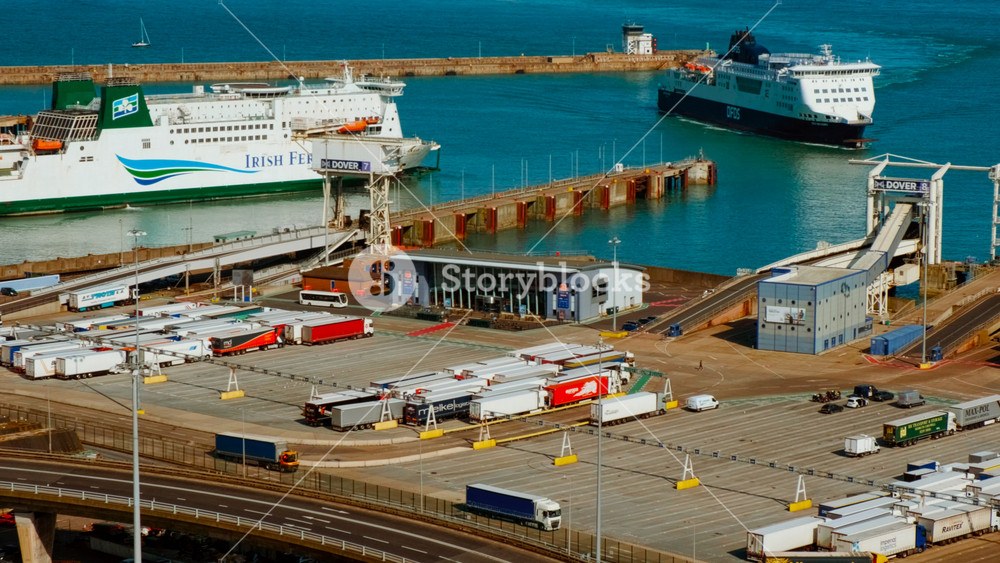 DOVER, United Kingdom, 12 June 2025 - The Port of Dover and the White Cliffs of Dover, Kent, England, UK, with ferries, piers and chalk headlands shaping a busy gateway