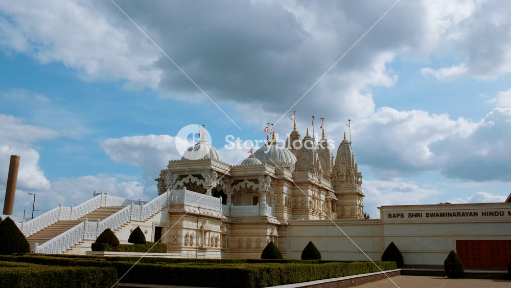 LONDON, United Kingdom, circa 2019 - Dramatic shot of the BAPS Shri Swaminarayan Mandir Hindu temple in Neasden, London, one of the largest Hindu temples outside India