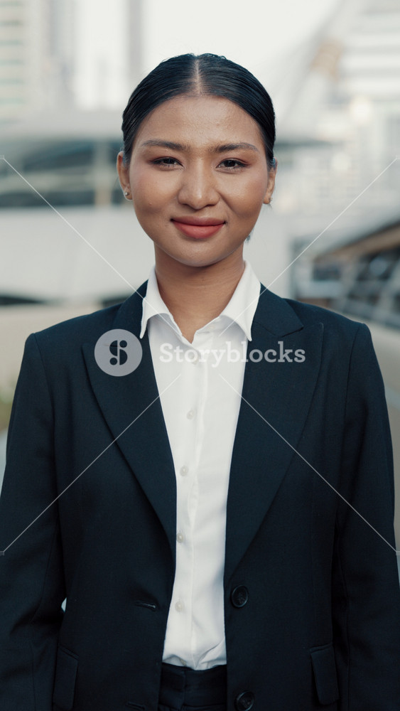 Vertical Video. Stylish, Confident Business Lady Standing in the Street and Posing to the Camera with Smile. Portrait of the Graceful Office