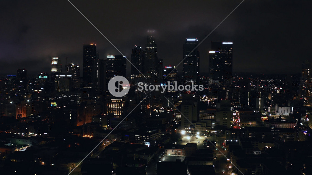 Experience the dazzling night skyline of Los Angeles with stunning aerial views over the vibrant city and its illuminated streets