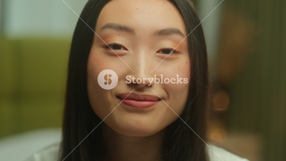 Close up headshot Asian girl model posing in studio at home smiling looking at camera Japanese woman young lady ethnicity Chinese Korean