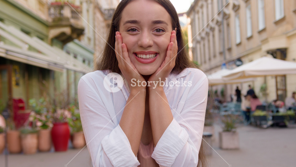 Young happy Caucasian woman enjoying smiling toothy dental smile fun joyful satisfied female looking at camera pleased model cheerful girl