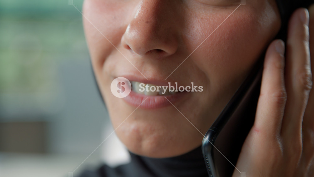 Close-up unrecognizable arabian muslim business woman in hijab talking phone mobile call happy Islamic businesswoman female mouth speaking
