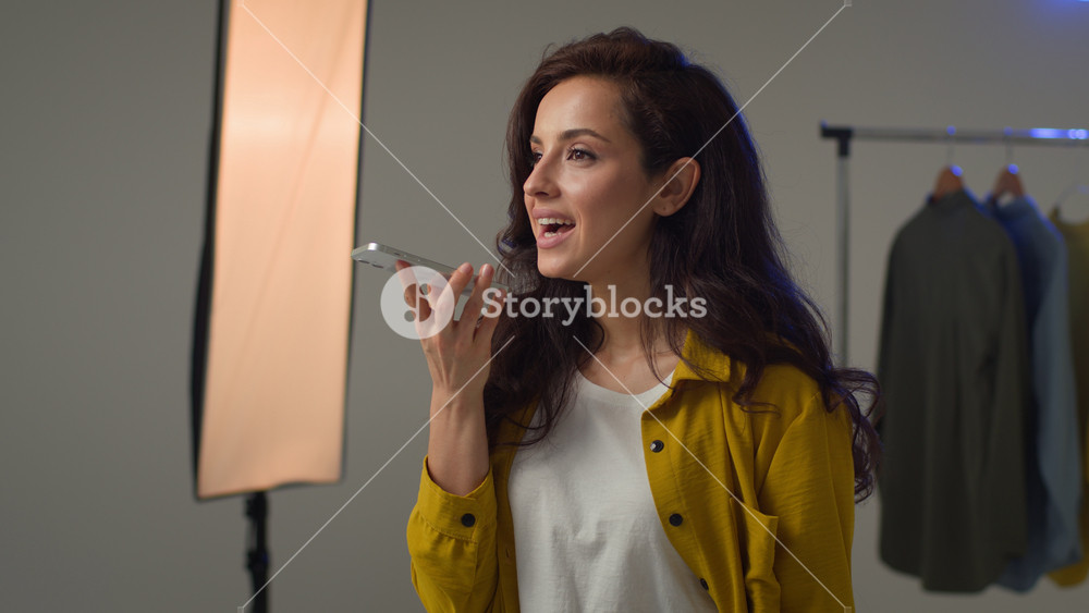 Happy positive Caucasian woman lady female blogger typing mobile phone cellphone recording voice message audio voicemail social network blog