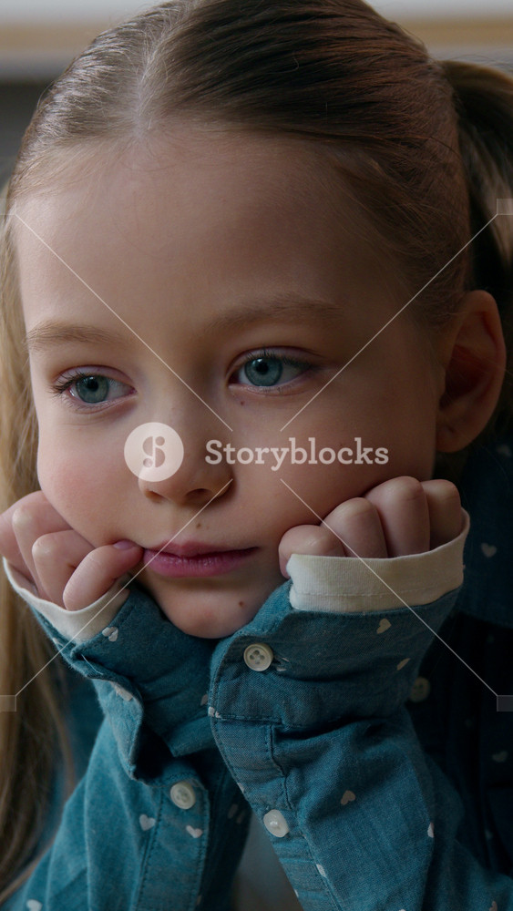 Close up frown sorrow little offended Caucasian sad upset bored child girl orphan unhappy emotional abuse lonely kid at home kitchen