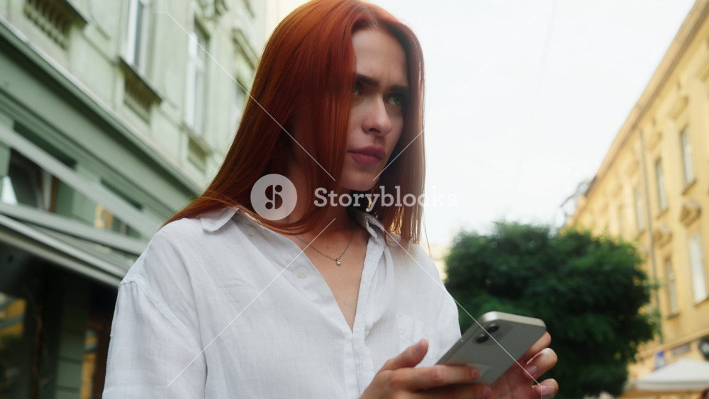 Upset confused Caucasian woman girl female tourist traveler looking around lost in city mobile phone direction gps app online map navigator