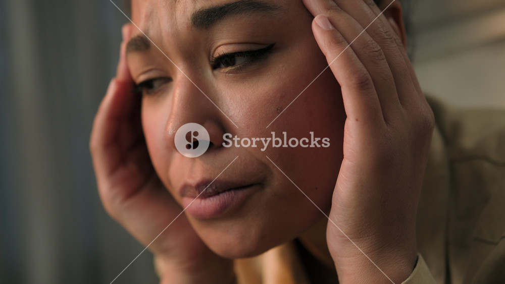 Close up woman face African American ethnic sad frustrated worried sorrowful stressed girl at home suffer health problem sick female holding