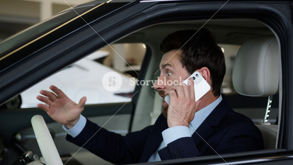 Caucasian happy man talking mobile phone smartphone victory businessman car emotional driver celebrate business speaking buyer guy win auto