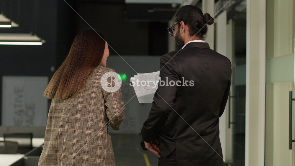 Back view multiracial business diverse colleagues Asian woman Chinese businesswoman Indian man Arabian businessman together happy smiling